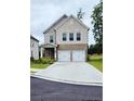 Attractive two-story home with a stone facade, brick accents, a manicured lawn and a convenient two-car garage at 1961 Ecoland Dr, Grayson, GA 30017