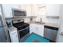 Charming kitchen with stainless steel appliances, granite counters, and white subway tile at 5400 Roswell Rd # K2, Atlanta, GA 30342