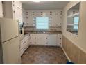 Functional kitchen with white cabinets, updated appliances, and ample counter space at 2990 Piedmont Dr, Marietta, GA 30066
