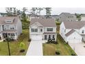 An aerial view showcasing the well-manicured front yard and landscaping of this beautiful two-story home at 895 Garnet Dr, Acworth, GA 30101