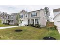 Beautiful two-story home with a two car garage, well-manicured lawn, and classic architecture at 895 Garnet Dr, Acworth, GA 30101