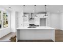 Stylish kitchen boasts a center island, stainless steel appliances, and a bright, airy atmosphere at 628 Skytop Dr # 158, Cumming, GA 30040