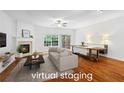 Spacious living room with fireplace and hardwood floors, perfect for entertaining at 651 Coligny Ct, Atlanta, GA 30350