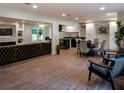 Open-concept living space featuring a seamless flow between the living, dining, and kitchen areas at 3790 Village Sw Dr, Atlanta, GA 30331