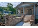 Charming craftsman home featuring a welcoming front porch and landscaped front yard at 5445 Eva Mamie Ln, Stone Mountain, GA 30083