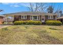 Lovely brick home with covered carport and manicured front yard at 965 Laurel St, Morrow, GA 30260