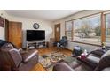 Cozy living room with wood floors, large window, and comfortable seating at 965 Laurel St, Morrow, GA 30260