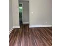 Bedroom area with wood flooring, fresh paint, leading to the ensuite bathroom at 2245 Polar Rock Sw Ave, Atlanta, GA 30315
