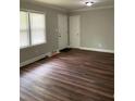 Living area featuring wood floors, fresh paint, and natural light from the windows at 2245 Polar Rock Sw Ave, Atlanta, GA 30315