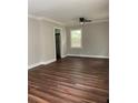 Bright living room with wood flooring and a ceiling fan, showcasing neutral paint at 2245 Polar Rock Sw Ave, Atlanta, GA 30315