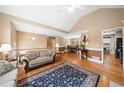 Bright living room with hardwood floors, a large rug, and an open layout at 6355 Autumn View Nw Pt, Acworth, GA 30101