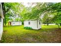 Spacious backyard featuring two storage sheds, perfect for extra storage or hobbies at 6539 E Strickland St, Douglasville, GA 30134