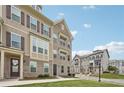 Attractive three-story townhouse with brick and siding accents, offering a cozy neighborhood feel at 2501 Painted Buckeye Chase Se, Smyrna, GA 30080