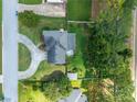 An aerial view showcases this home's prime location, well-manicured lawn, and patio area at 1670 Burnt Oak Way, Dacula, GA 30019