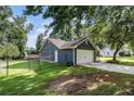 View of home featuring a two-car garage, an enclosed backyard, and a wooden deck at 50 Blackberry Lane, Covington, GA 30016