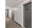 Long hallway with neutral carpet and doors showing unit number 911 at 620 Peachtree Ne St # 911, Atlanta, GA 30308