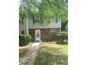 Inviting townhome with brick accents, green shutters, and a well-kept lawn. The house number is clearly visible at 8959 Stonebridge Blvd, Douglasville, GA 30134