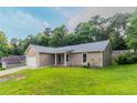 Inviting single-Gathering home with a green lawn, showcasing its neat exterior and curb appeal at 1333 Trailwater Chase Nw, Acworth, GA 30102