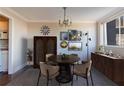 Elegant dining room with a round table, stylish chandelier, and curated artwork for sophisticated meals at 215 Piedmont Ne Ave # 502, Atlanta, GA 30308