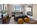 Serene bedroom with a plush bed, accent mirror, and city views creates a relaxing retreat at 215 Piedmont Ne Ave # 502, Atlanta, GA 30308