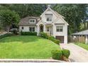 Beautiful two-story home with a well-maintained lawn and a private driveway at 480 Wimbledon Ne Rd, Atlanta, GA 30324
