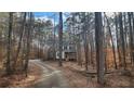 Charming two-story home nestled among mature trees and a private drive at 488 Morris Rd, Hiram, GA 30141