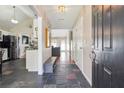 Inviting foyer with beautiful tile flooring and an open view into the living spaces at 4920 Markim Forest Ln, Sugar Hill, GA 30518