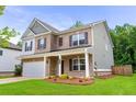 Charming home featuring a combination of brick and siding, enhancing its curb appeal at 939 Brittfield Way, Loganville, GA 30052