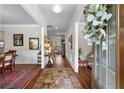 Elegant foyer with hardwood floors, wainscoting, and stylish decor leading into the home at 850 Ethereow Ct, Lawrenceville, GA 30046