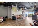 Open living room features hardwood floors, neutral walls, and an abundance of natural light from the windows at 120 Ralph Mcgill Ne Blvd # 1409, Atlanta, GA 30308