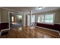 Dining area features hardwood floors, wainscoting, and natural light at 6109 N Main Se St, Acworth, GA 30101