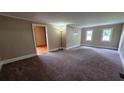 Bright living room with plush carpeting and natural light at 6109 N Main Se St, Acworth, GA 30101