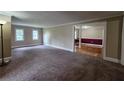 Spacious living room with carpet flooring and neutral paint at 6109 N Main Se St, Acworth, GA 30101