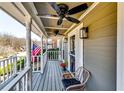 Inviting covered front porch with ceiling fans, stylish decor, and ample space for relaxation and enjoying the outdoors at 845 Connell Ln, Lawrenceville, GA 30044