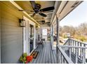 Comfortable covered front porch with ceiling fans, stylish decor, and ample space for relaxation and enjoying the outdoors at 845 Connell Ln, Lawrenceville, GA 30044