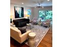 Bright living room featuring stylish furnishings, hardwood floors, and a sliding door at 1240 Woodland Ne Ave # 7, Atlanta, GA 30324