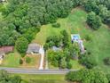 An aerial view showing property including homes and a large yard at 4444 Cannon Sw Rd, Loganville, GA 30052
