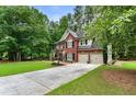 Beautiful two-story home with a two-car garage and long private driveway at 4401 Madison Woods Nw Dr, Marietta, GA 30064