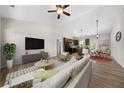 Inviting living room with vaulted ceilings, contemporary furnishings, and views of the kitchen and dining area at 389 Campground School Rd, Dallas, GA 30157