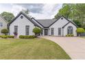 Well-maintained home with lush lawn and attractive landscaping at 220 Chandler Ct, Sugar Hill, GA 30518