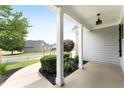Covered front porch featuring white columns and landscaping, offering a welcoming outdoor space at 21 Spring Folly Nw, Cartersville, GA 30121