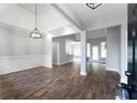 Open-concept living room with hardwood floors, modern lighting, and bright, neutral paint at 21 Spring Folly Nw, Cartersville, GA 30121
