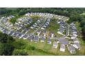 Expansive aerial view of a modern residential community with manicured green spaces and well-maintained homes at 5090 Bellehurst Ln, Cumming, GA 30040
