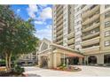 The entrance to the building has a covered entrance and beautifully maintained landscaping at 799 Hammond Dr # 325, Atlanta, GA 30328