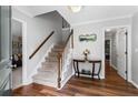 Inviting foyer with hardwood floors, staircase, and views into adjacent rooms at 3131 Sumter Ct, Marietta, GA 30062
