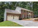 Beautiful brick home featuring a two-car garage and a well-maintained front yard at 4782 Donnegal Se Ct, Mableton, GA 30126