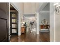 Elegant foyer with hardwood floors, stately columns, and a glimpse of the staircase at 2375 Hyde Park Nw Ct, Atlanta, GA 30318
