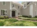 A beautifully landscaped front entrance with a manicured lawn and brick walkway leading to the front door at 2375 Hyde Park Nw Ct, Atlanta, GA 30318