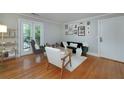 Bright living room with hardwood floors, modern furniture, and access to a balcony at 2023 Oakview Se Rd # 226, Atlanta, GA 30317