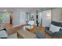 Open-concept living area with hardwood floors, a modern barn door, and lots of natural light at 2023 Oakview Se Rd # 226, Atlanta, GA 30317
